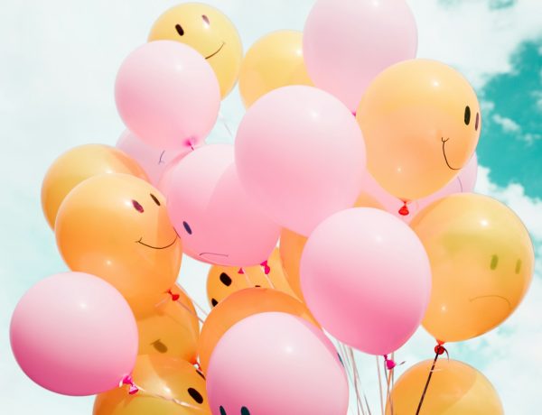 low-angle photo of pink and orange balloons